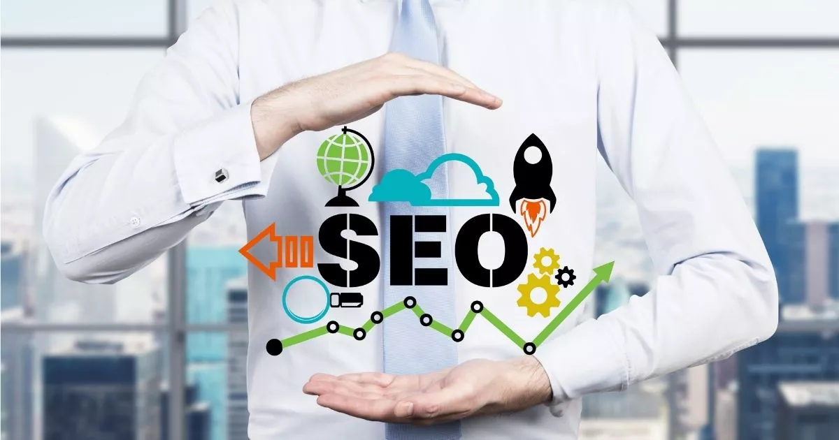Businessman in a white shirt holding hands around SEO typography surrounded by digital marketing icons.